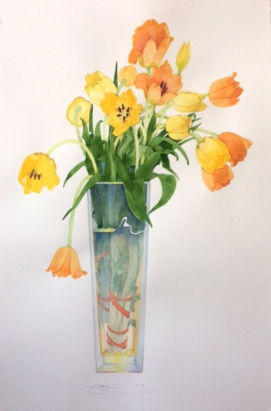 Bright tulips in a tall vase